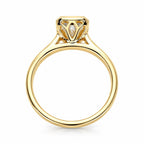 Side profile view of a 4 CT radiant cut lab grown diamond ring in yellow gold showing the petal filigree basket undergallery.