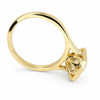 Tilted profile shot showing the polished yellow gold band and carved undergallery of a 4 CT radiant lab diamond ring.