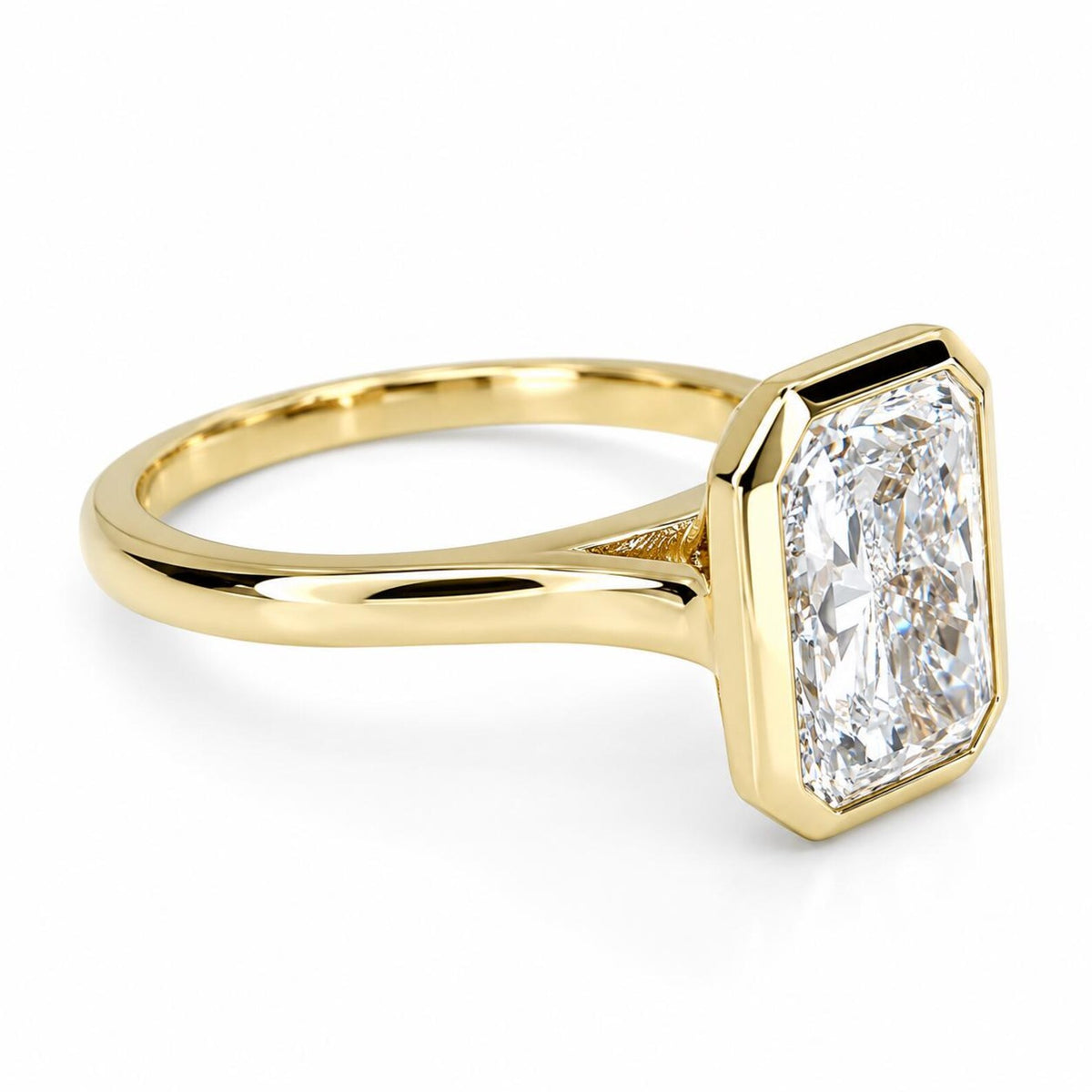 Low three-quarter view highlighting the high-polish yellow gold shank and bezel setting on a 4 CT radiant ring.