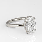 Perspective view of an elongated 3 CT oval cut lab grown diamond ring on a plain white gold band.