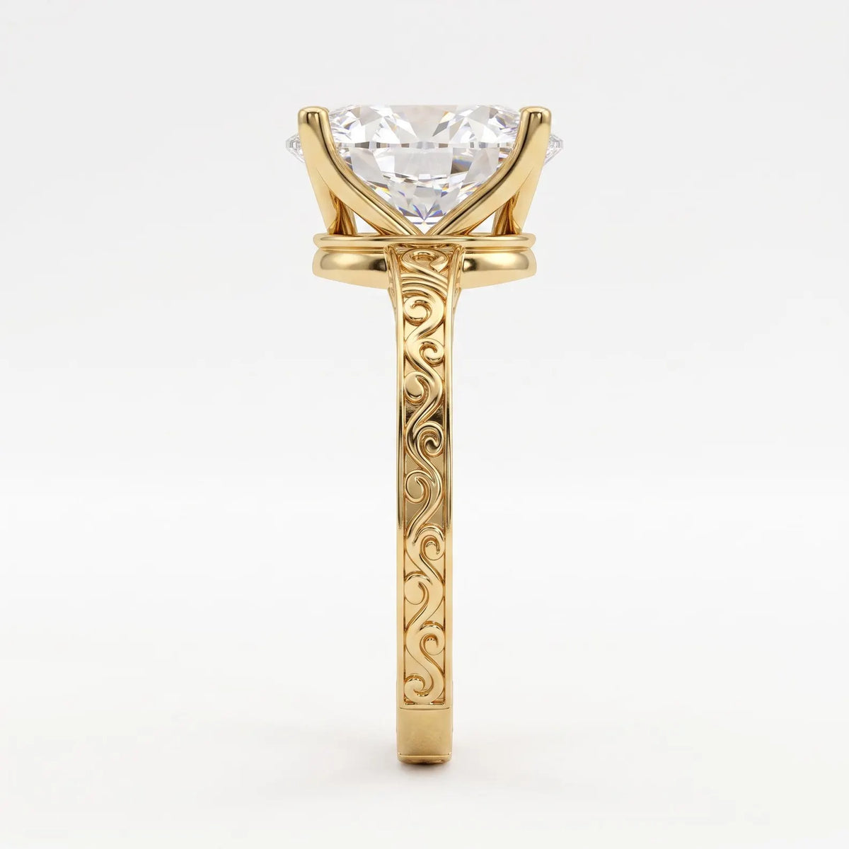 Side profile view showing intricate scrollwork engraving on a 14K yellow gold band with a 3 CT oval diamond.