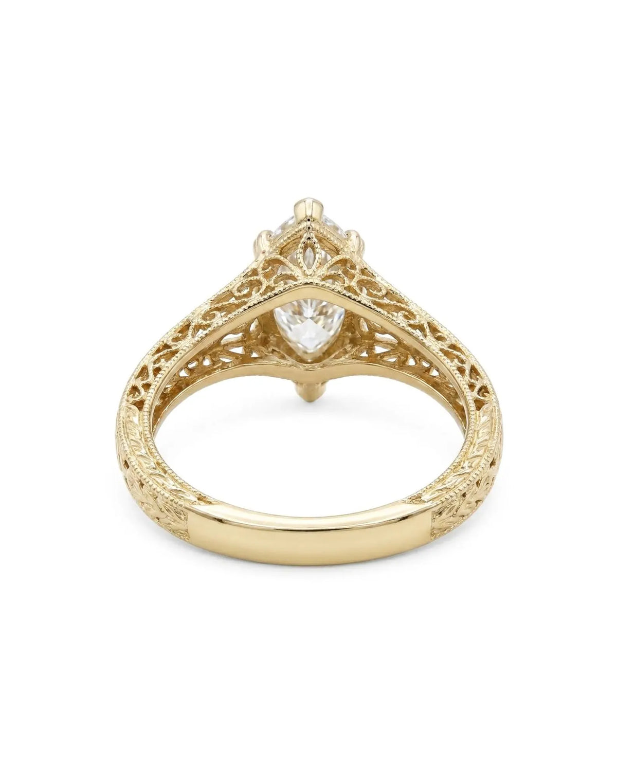Undergallery view showing openwork filigree scrollwork on a 4 CT marquise lab diamond gold ring.