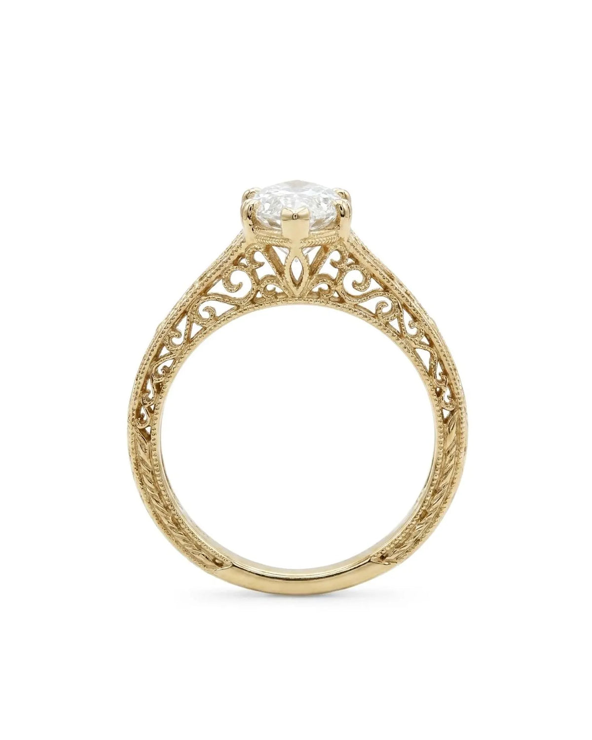 Side profile view of a 4 CT marquise cut lab grown diamond ring with carved filigree scrollwork and milgrain trim.