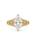 Direct top view of a 4 CT marquise cut lab grown diamond set in a 6-prong vintage filigree yellow gold ring.