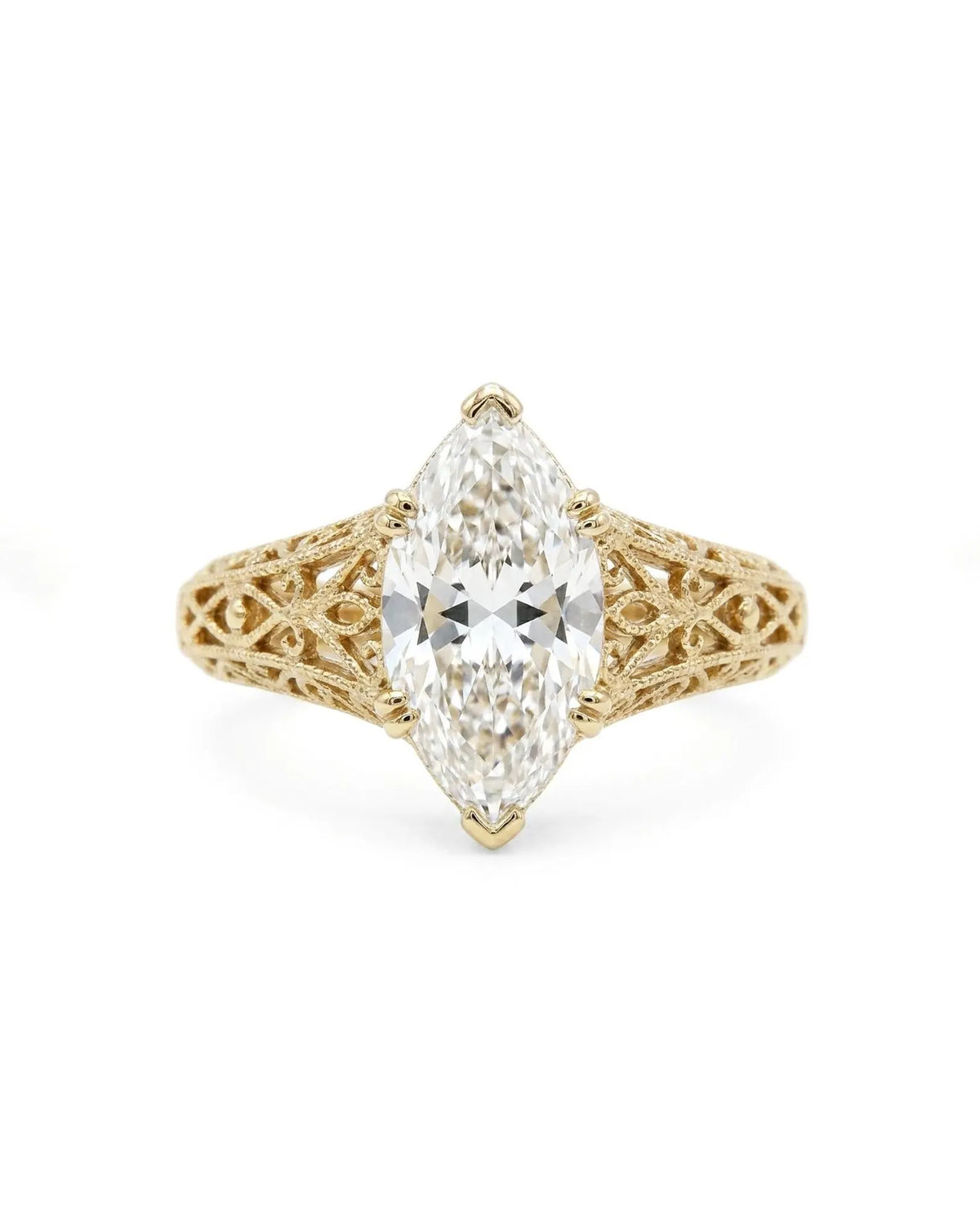 Direct top view of a 4 CT marquise cut lab grown diamond set in a 6-prong vintage filigree yellow gold ring.