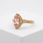 Elevated display view of a 3 CT pink marquise lab grown diamond filigree engagement ring.