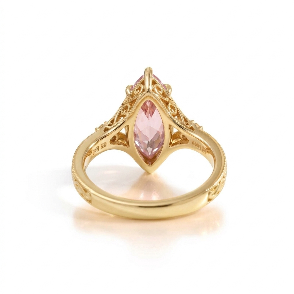 Undergallery perspective view of a 3 CT pink marquise diamond ring set in yellow gold.