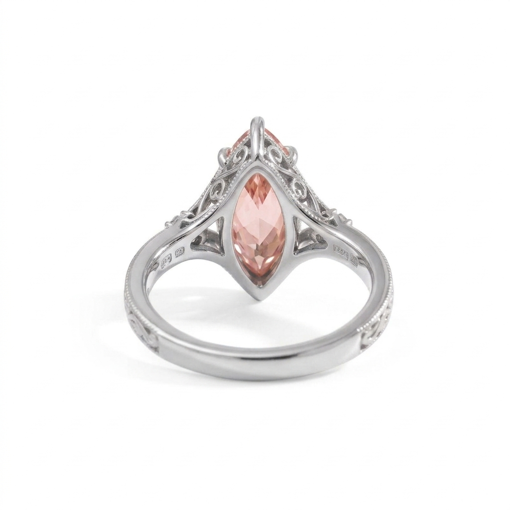 Looking through the band at the undergallery setting of a 3 CT pink marquise lab diamond ring in white gold.