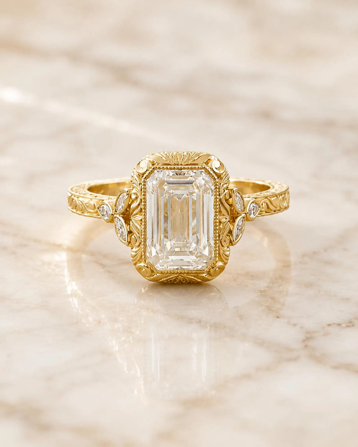 Detailed front-facing view of a 4 CT emerald cut lab grown diamond in a vintage engraved yellow gold bezel ring.