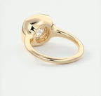 Bottom angle view highlighting the open under-gallery setting of the yellow gold bezel diamond ring.
