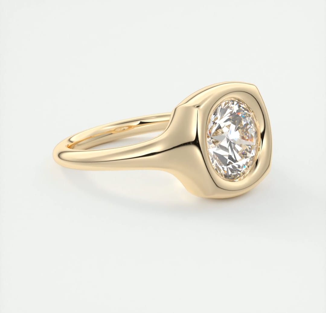 Angled front shot displaying the intense brilliance of a 3 CT round lab grown diamond in gold bezel setting.