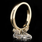 Bottom angle profile view showing the intricate under-gallery, hidden halo pavé setting, and two-tone metal structure.