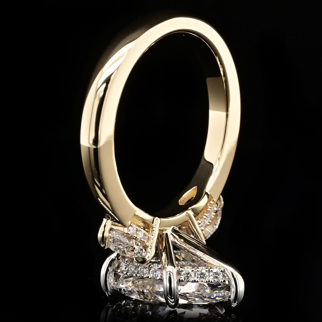 Bottom angle profile view showing the intricate under-gallery, hidden halo pavé setting, and two-tone metal structure.