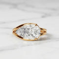 Direct top view displaying the brilliant horizontal pear cut diamond set in a gold bezel setting.