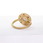 Underside view of a 4 CT round lab grown diamond ring showing the matte gold halo setting and smooth round band.