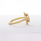 Side profile of a 14K yellow gold engagement ring featuring a tiered brushed bezel head and smooth shank.