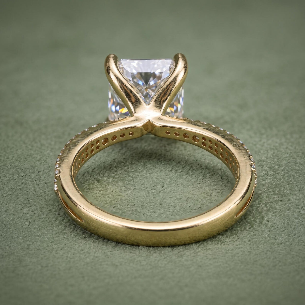 Rear view displaying the basket support structure and smooth bottom band of a lab grown diamond ring.