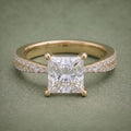 Direct front top view showing a 2 CT princess cut lab diamond centered on a double pavé yellow gold band.