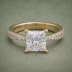 Direct front top view showing a 2 CT princess cut lab diamond centered on a double pavé yellow gold band.