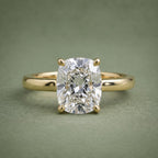 Direct top view of a 3 CT elongated cushion cut lab grown diamond set on a plain 18K yellow gold band.