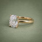 Perspective view highlighting diamond brilliance and the 750 hallmark stamp inside the yellow gold shank.