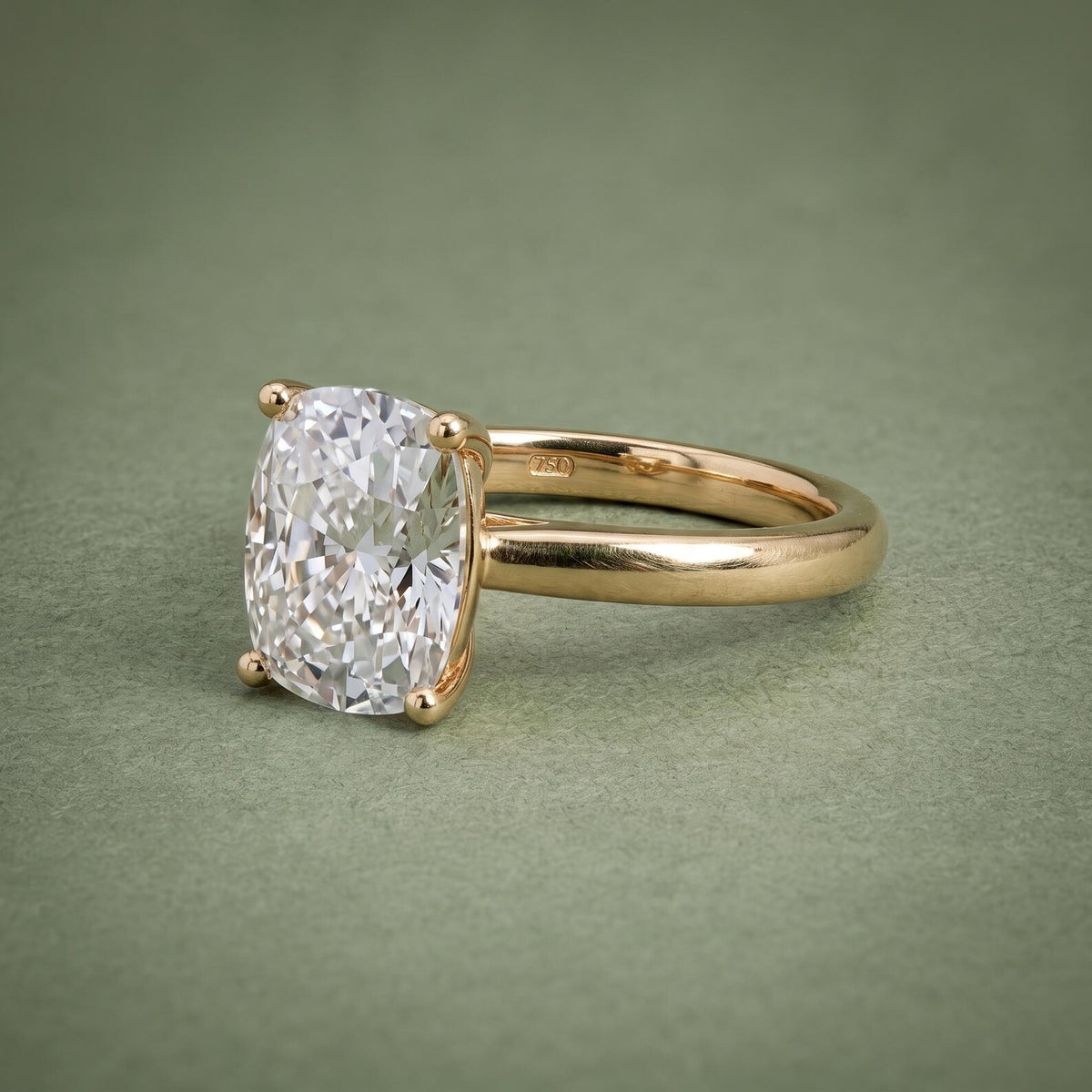 Perspective view highlighting diamond brilliance and the 750 hallmark stamp inside the yellow gold shank.