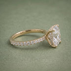 Alternate side angle of a 3 carat cushion lab grown diamond engagement ring with diamond accent band.