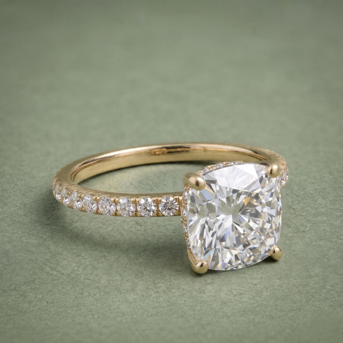 High-angle perspective view of an elongated cushion cut diamond engagement ring with hidden halo setting.