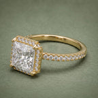 Three-quarter perspective of a 4 CT square princess cut lab diamond halo engagement ring in yellow gold.