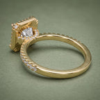 Rear perspective view showcasing the polished 18K yellow gold band and underlying diamond halo structure.