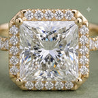 Macro close-up top view displaying the intricate faceting of a 4 carat princess cut center diamond and halo border.