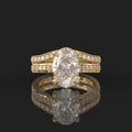 Front view of a 3 CT oval cut lab diamond engagement ring and curved wedding band set in yellow gold.