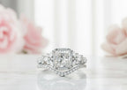 White gold 3 CT princess cut lab diamond halo ring set with marquise cluster shoulders and curved wedding band.