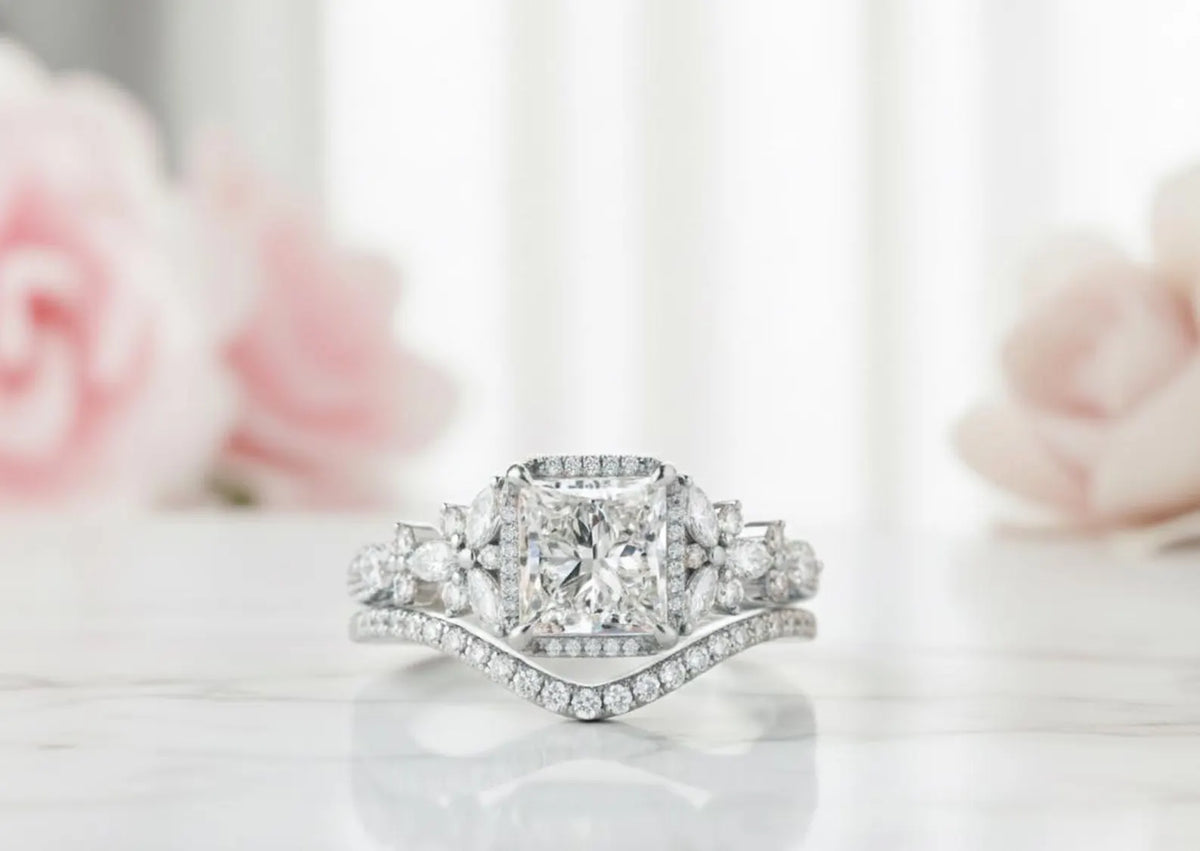 White gold 3 CT princess cut lab diamond halo ring set with marquise cluster shoulders and curved wedding band.