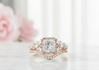 Close-up front view of a 3 CT princess cut lab diamond halo ring with curved diamond band in rose gold.