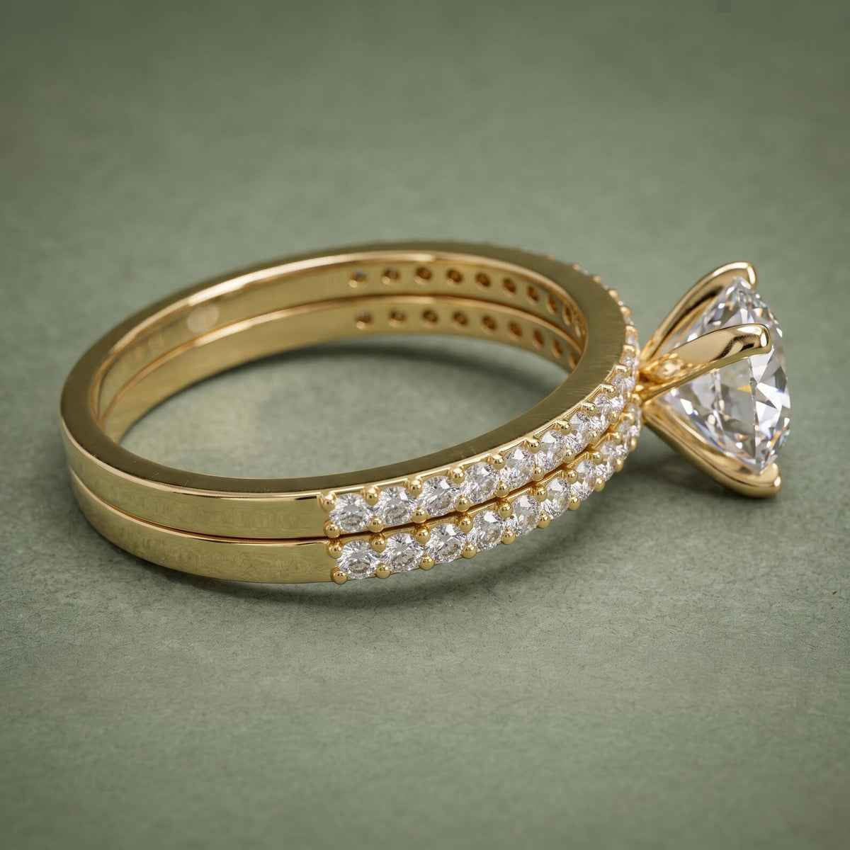 Side profile showing four-prong setting and pavé detailing on 3 CT round lab diamond bridal set.