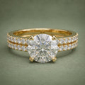 Direct top view of 3 CT round brilliant cut lab grown diamond solitaire paired with matching pavé band.