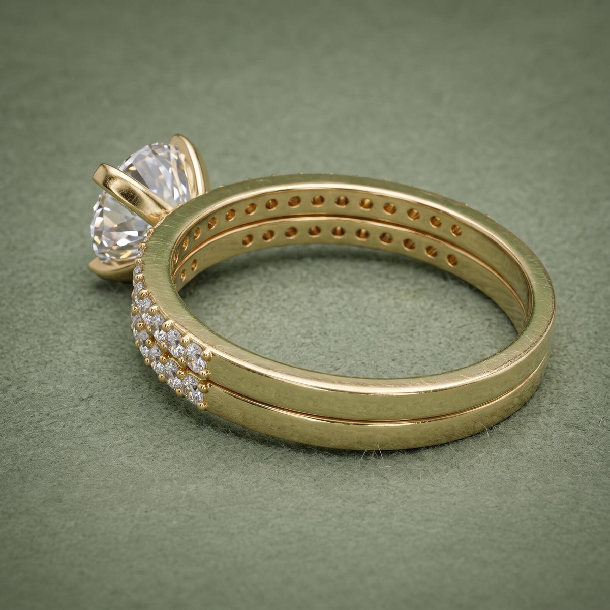 Back angle perspective of 3 CT round brilliant lab diamond solitaire and stacked pavé wedding ring.