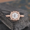 Direct top view of 2 CT round cut lab grown diamond set inside an intricate geometric pavé halo frame.