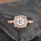 Direct top view of 2 CT round cut lab grown diamond set inside an intricate geometric pavé halo frame.