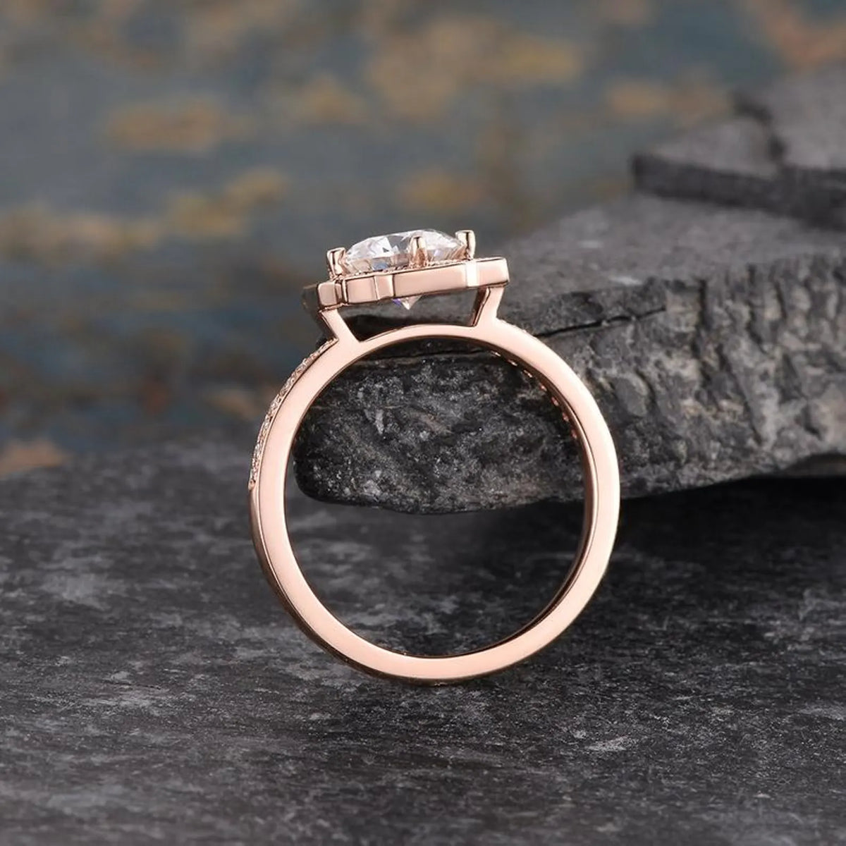 Side profile view of rose gold 2 carat round lab grown diamond ring showing gallery height and band detail.