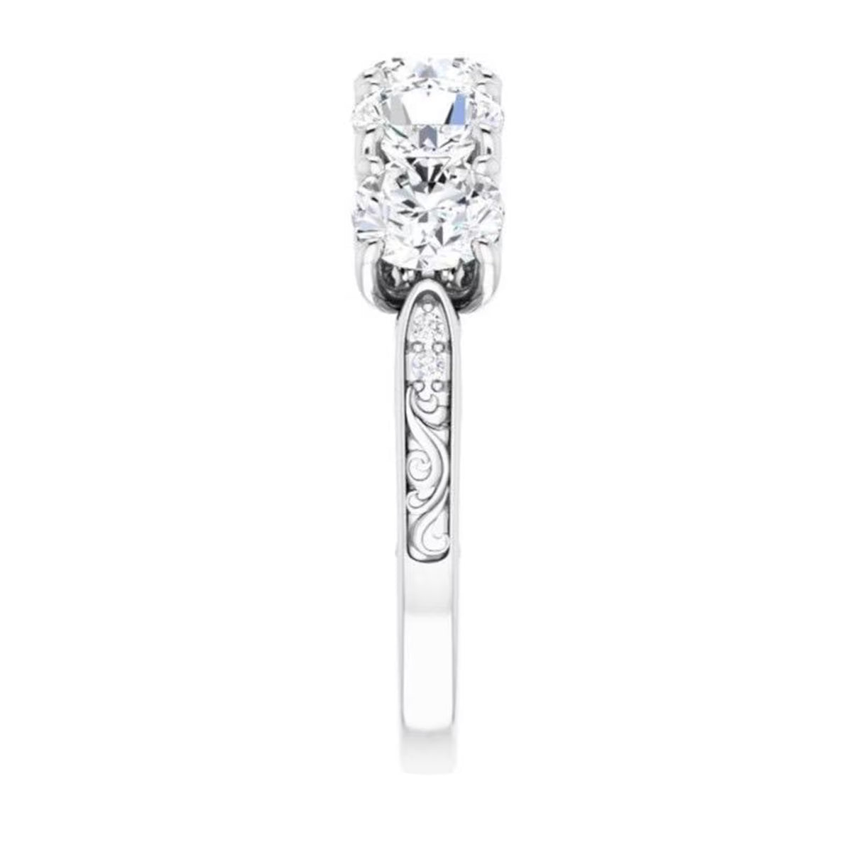 Side elevation view highlighting the hand-engraved scroll accents on the shank of a white gold 5-stone diamond ring.