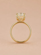 Side profile of a 4 CT oval lab grown diamond ring in 18K yellow gold showing hidden halo gallery detail.