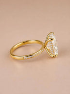 Side angle view of 4 CT oval cut lab grown diamond ring set in 18K yellow gold.