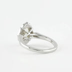 Rear angled view of a 3 CT oval lab grown diamond ring showing white gold arch basket structure.