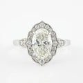 Top-down view of a 3 CT oval cut lab grown diamond in an Art Deco scalloped halo setting.