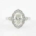 Top-down view of a 3 CT oval cut lab grown diamond in an Art Deco scalloped halo setting.