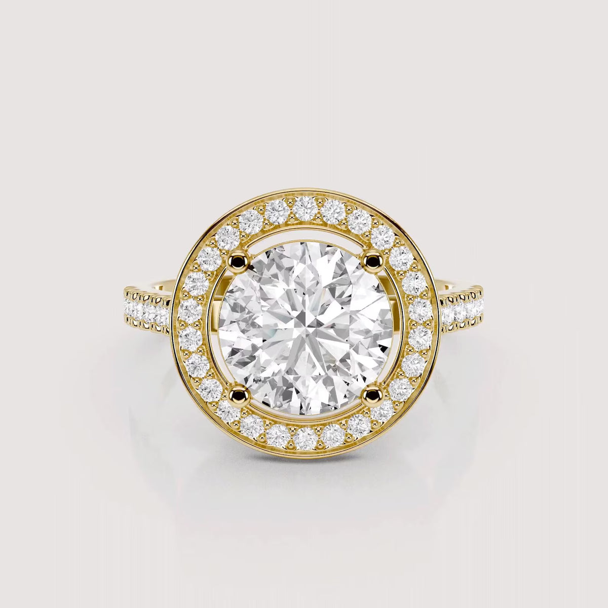 Direct top-down view of a 4 CT round lab grown diamond halo ring in yellow gold.