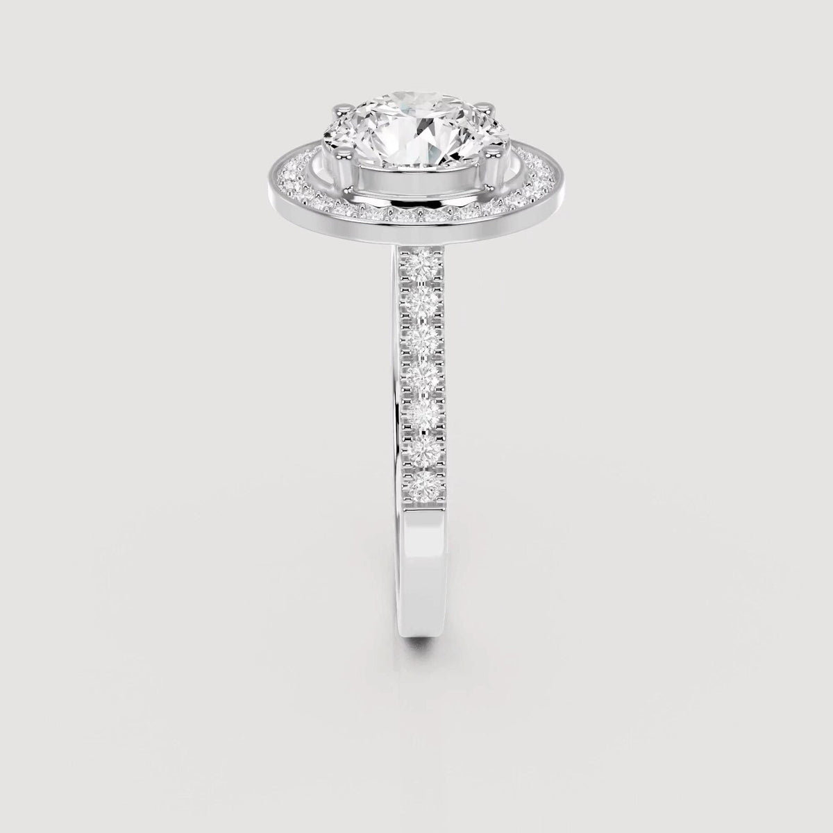 Side profile view of a 4 CT round lab grown diamond halo engagement ring in white gold.