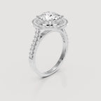 Angled side view showing cathedral band of 4 CT round lab diamond halo ring in white gold.